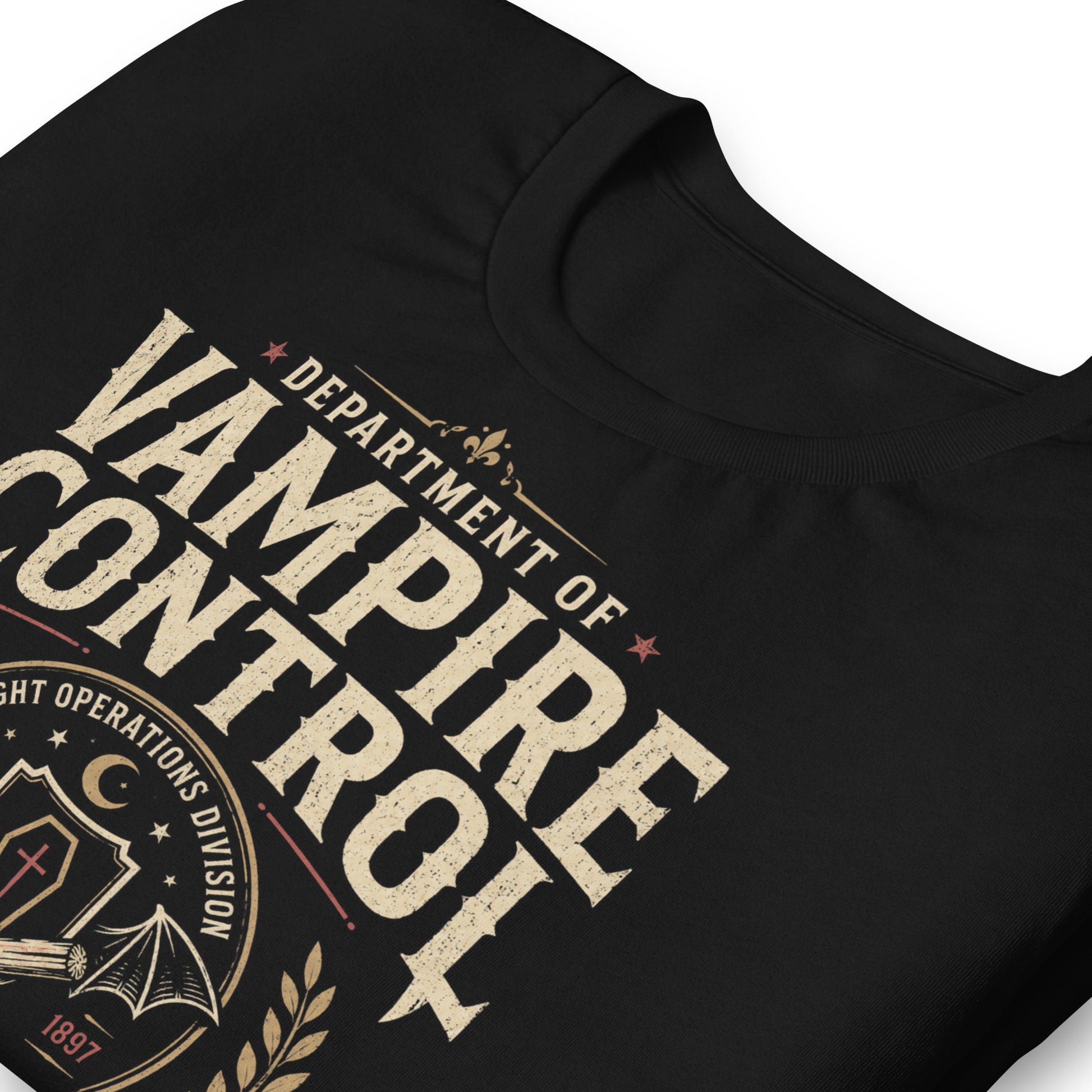 Close-up of Department of Vampire Control t-shirt design with official field unit banner, vampire fangs, and nocturnal threat response text