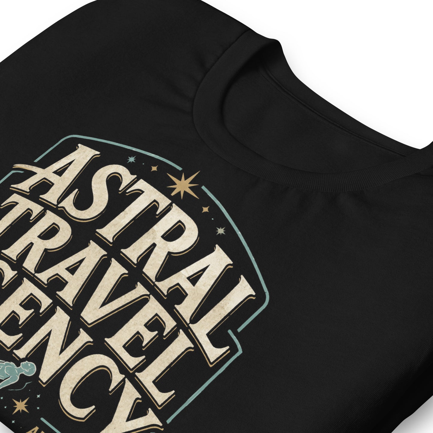 Black graphic tee featuring original Cinderpoint Studios artwork for Astral Travel Agency, a retro occult travel design with large vintage lettering, astral projection imagery, stars, and text including Official Booking Office, Akashic Tours, and Out-of-Body Excursions.