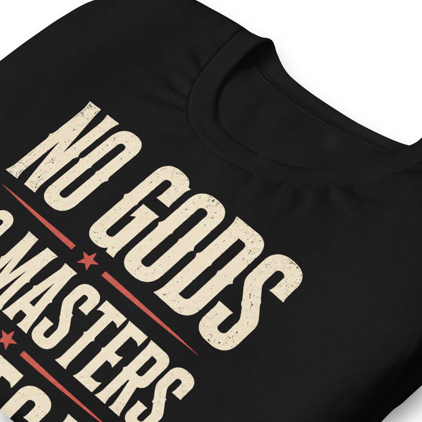 Close up of a black graphic tee featuring original Cinderpoint Studios artwork for No Gods No Masters No Decaf, a bold retro text design with cream lettering, red accent stars, lightning bolts, and a small coffee cup graphic.