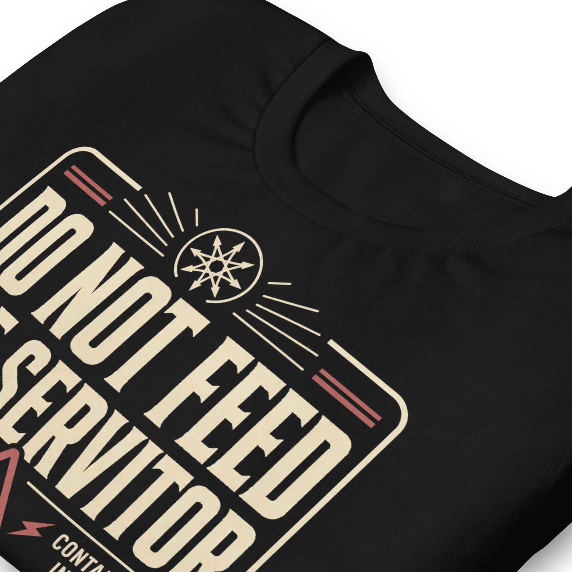 Close up of a black graphic tee featuring original Cinderpoint Studios artwork for Do Not Feed the Servitor, a retro occult warning-sign design with bold vintage lettering, a chaos star symbol, a hazard icon, and text including Active Thoughtform, Containment in Effect, Authorized Personnel Only, and Occult Maintenance Division.