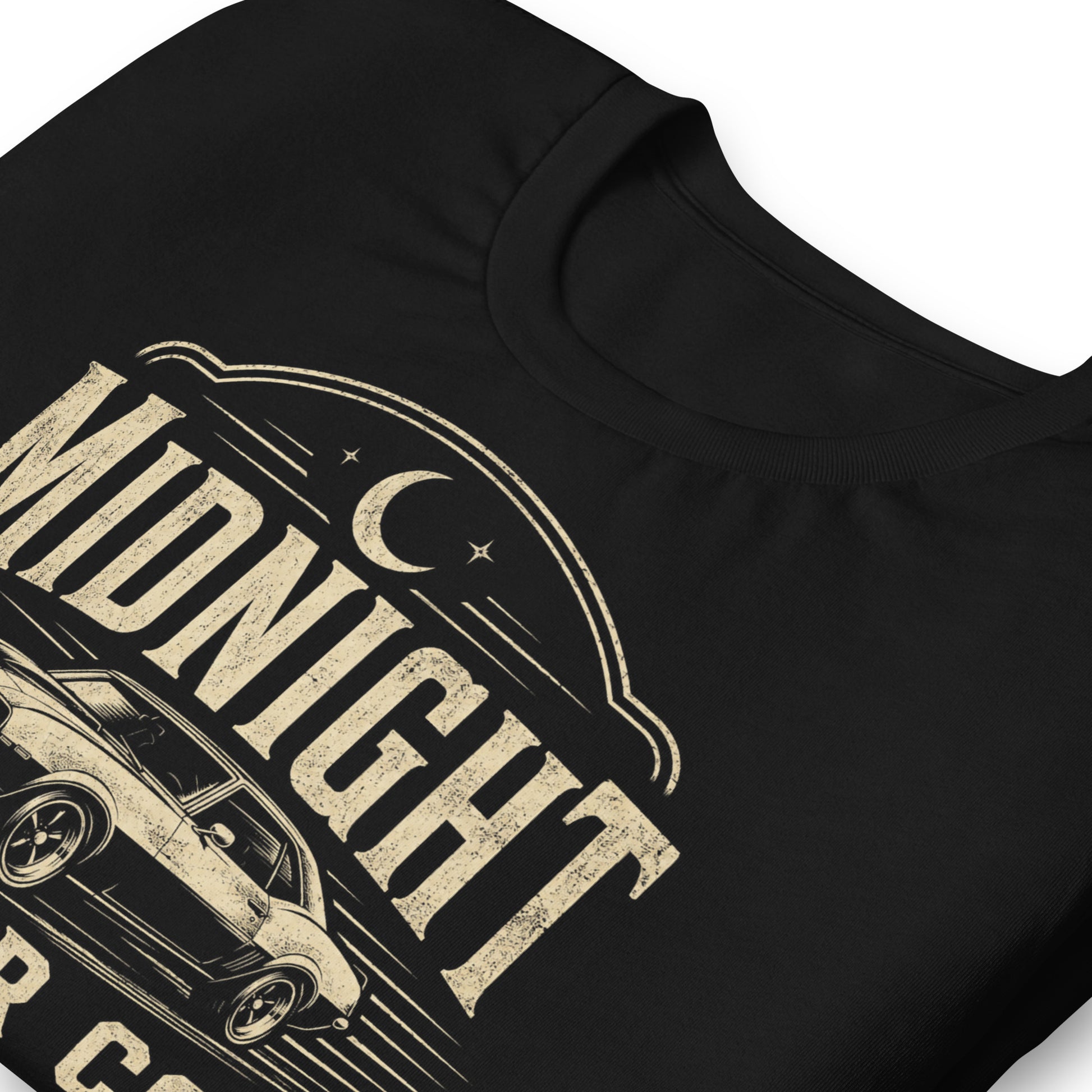 A black graphic tee featuring original Cinderpoint Studios artwork for Midnight Motor Co., a retro hot rod garage design with a classic muscle car, crescent moon, spark plug detail, vintage lettering, red accent stripes, and After Hours Speed text.