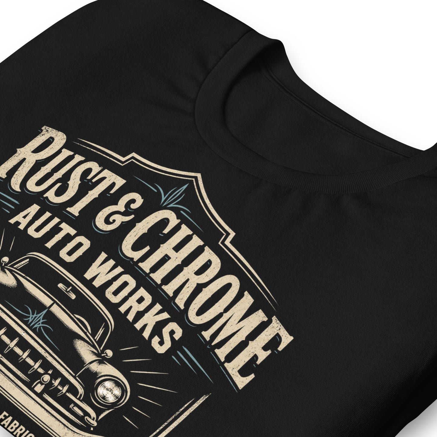 A black graphic tee featuring original Cinderpoint Studios artwork for Rust & Chrome Auto Works, a vintage garage design with a front-facing classic car, bold lettering, wrench accent, spark plug detail, restoration and custom fabrication text, and shield-style framing.
