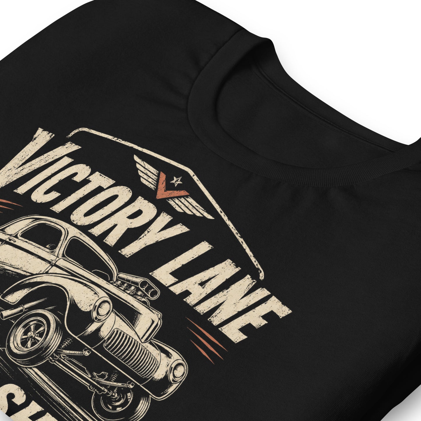 Black graphic tee featuring original Cinderpoint Studios artwork for Victory Lane Speed Shop, a retro hot rod design with a gasser-style car launching hard, bold vintage lettering, spark plug accents, orange speed details, and Built Fast Built Right text.