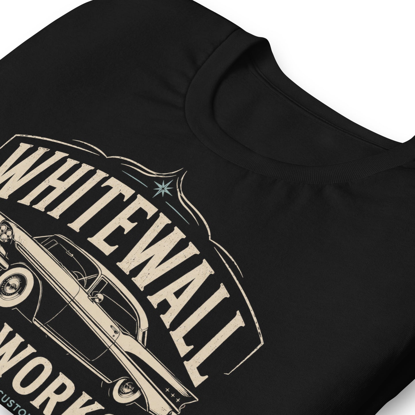 Black graphic tee featuring original Cinderpoint Studios artwork for Tailfin Classics, a retro auto service center design with a 1950s-style classic car, bold tailfins, vintage lettering, teal accents, crossed wrenches, spark plugs, and Alignment Brakes Suspension text.