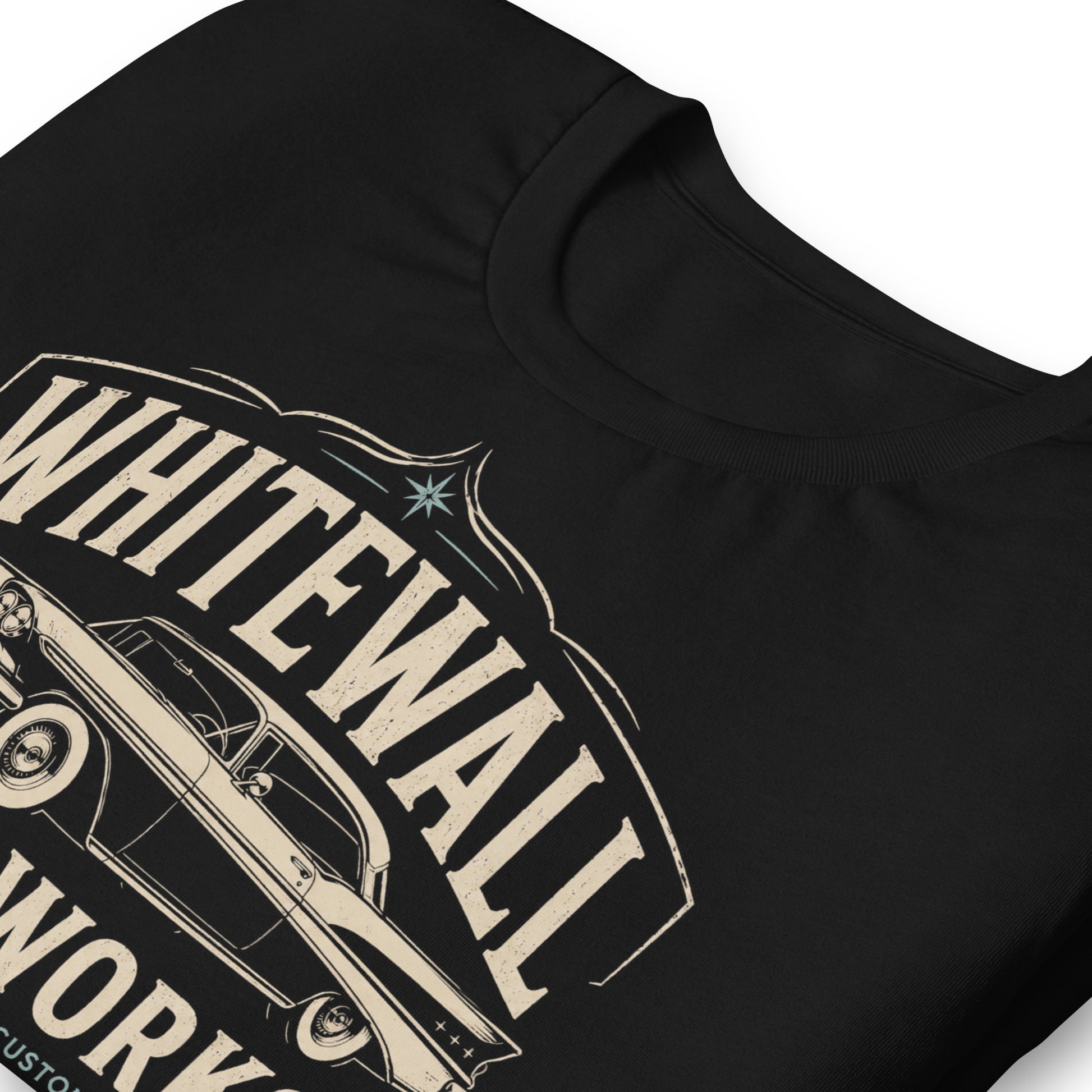 Black graphic tee featuring original Cinderpoint Studios artwork for Tailfin Classics, a retro auto service center design with a 1950s-style classic car, bold tailfins, vintage lettering, teal accents, crossed wrenches, spark plugs, and Alignment Brakes Suspension text.