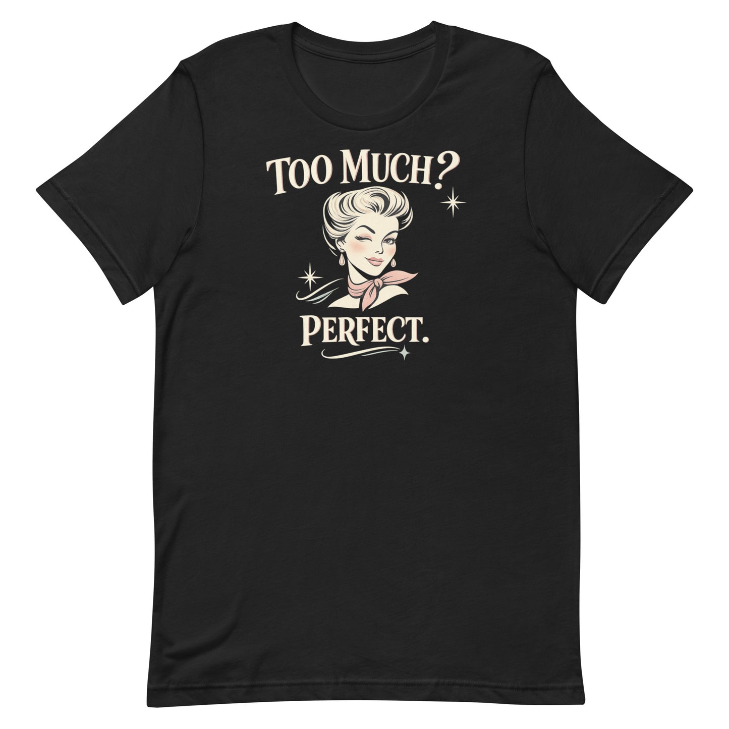 A close-up photograph of a vintage black short-sleeved t-shirt with a soft, faded charcoal appearance. The 'Too Much? Perfect.' graphic is shown with high-contrast cream and pink elements.
